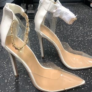 White stilettos with gold ankle details some of the jewels fell off